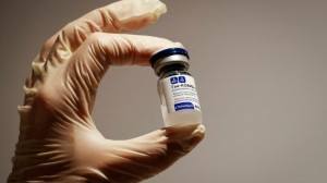 a_medical_specialist_holds_a_vial_of_sputnik_v_vaccine_against_the_coronavirus_at_a_vaccination_center_in_the_state_department_store_gum_in_central_moscow_russia_january_18_2021._reuters